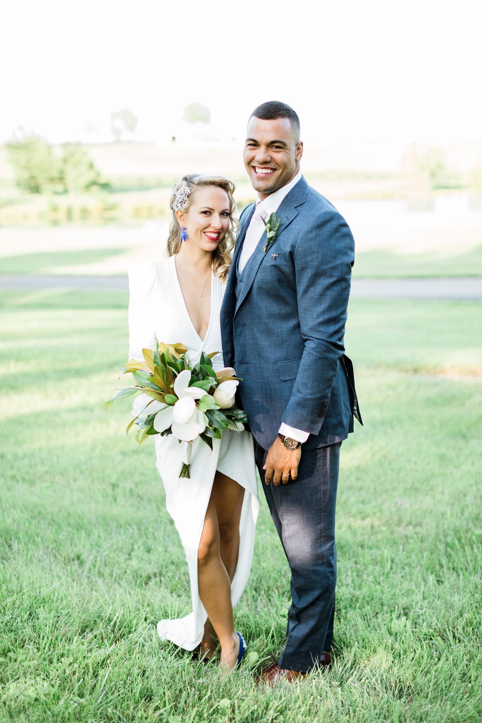 Newlyweds on the lawn before the manor