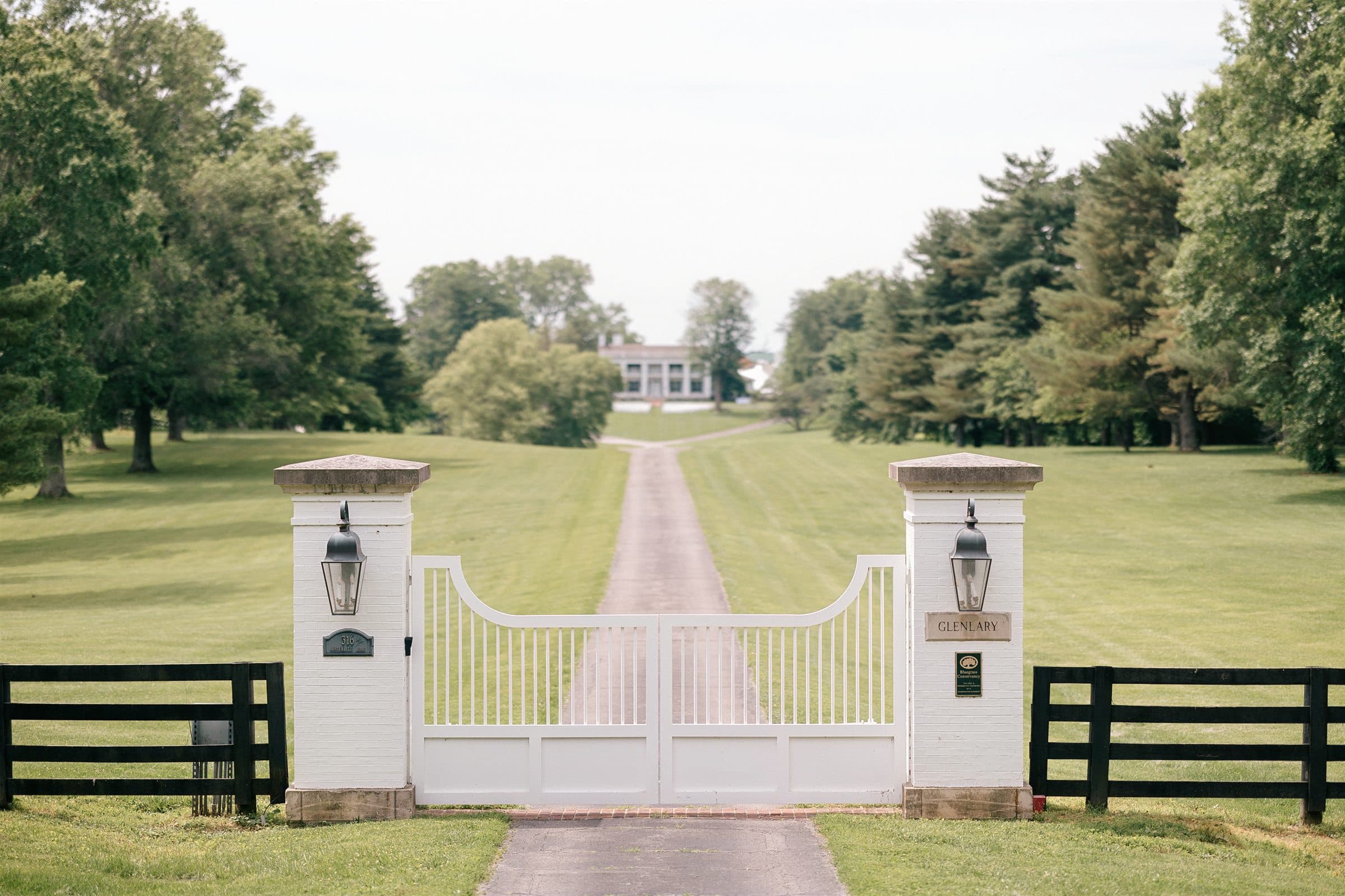 The white gates and the long drive to the manor