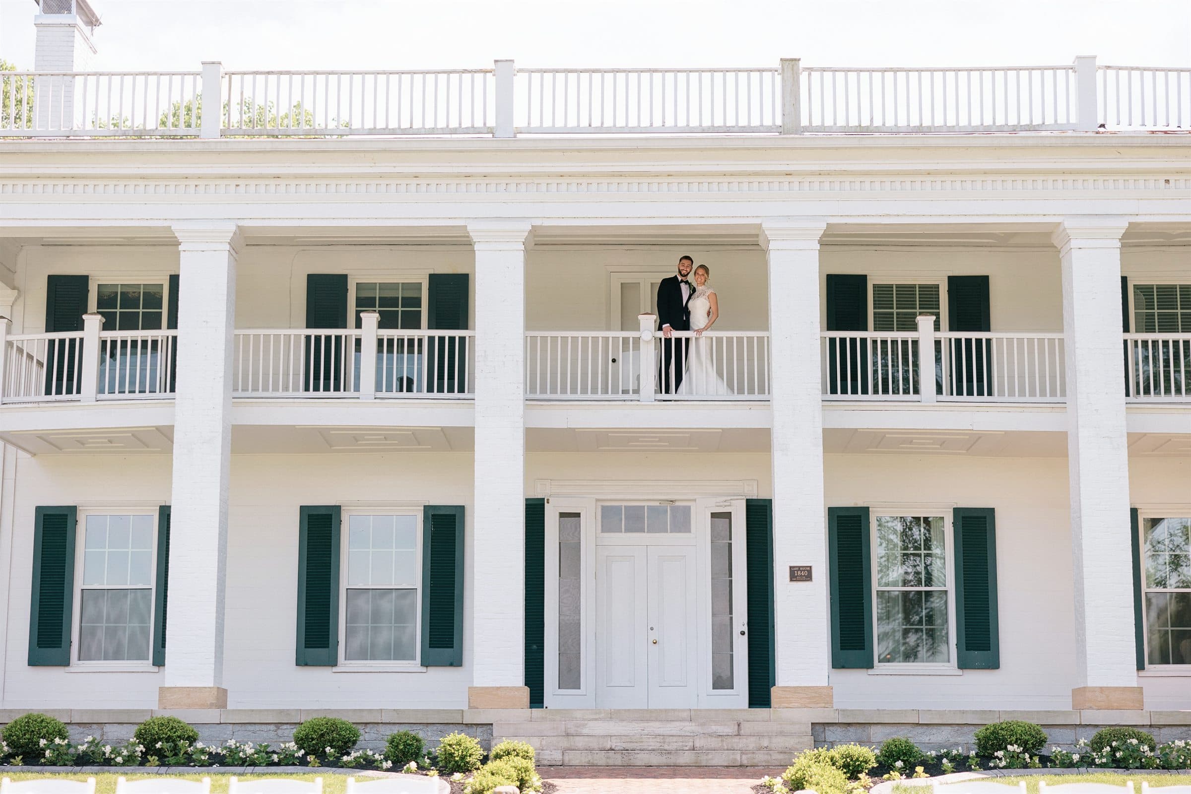 The Lary Manor's columns and double gallery, newlyweds on the upper porch