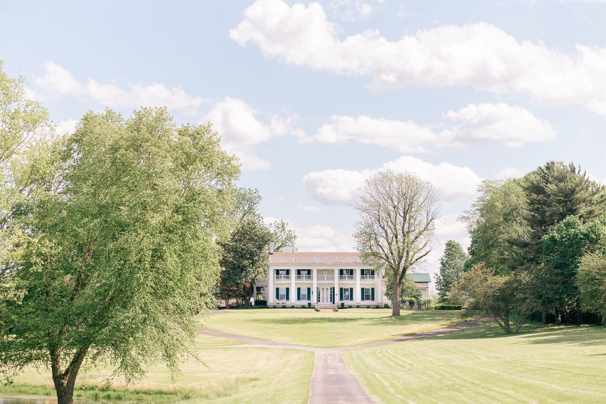 The manor across the bright spring lawn