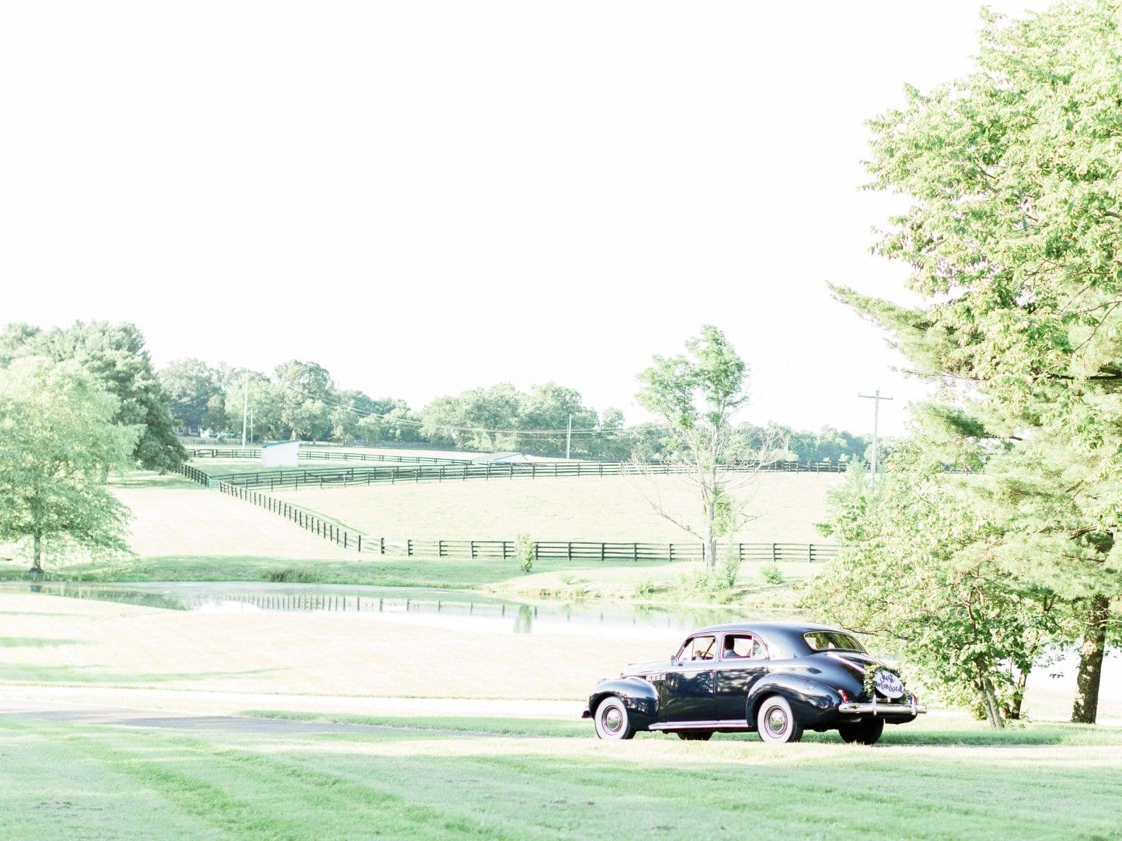 A vintage car waiting on the lawn